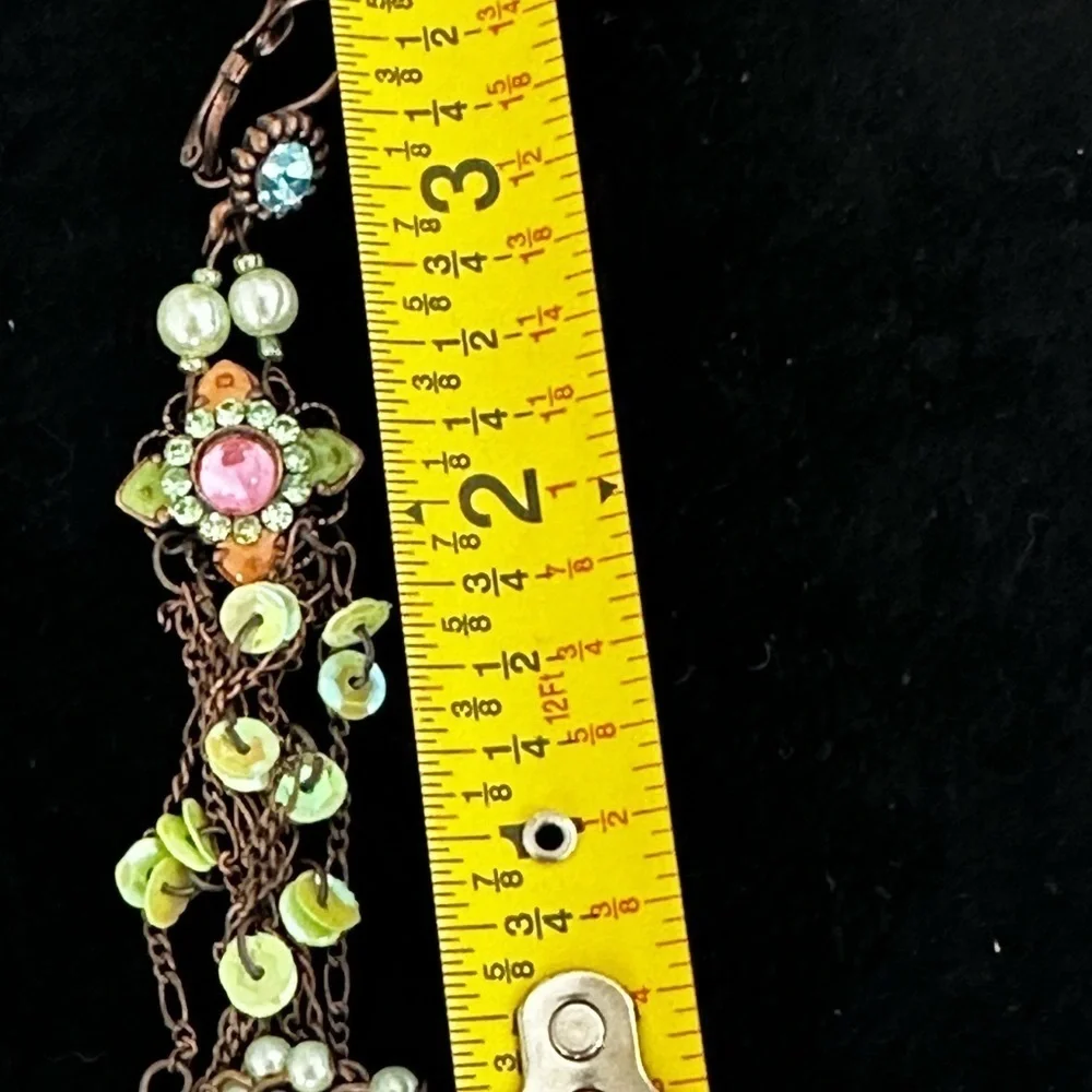 Pierced long dangling earrings of green and pink crystals and pearl like beads